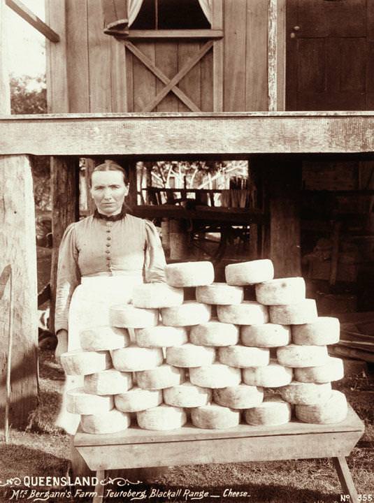 A woman with a stack of cheeses at Mrs Bergann's Farm, Teutoberg, Blackall Range, 1899
