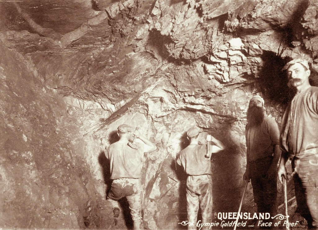 Four miners at face of reef in Gympie Goldfield, 1897