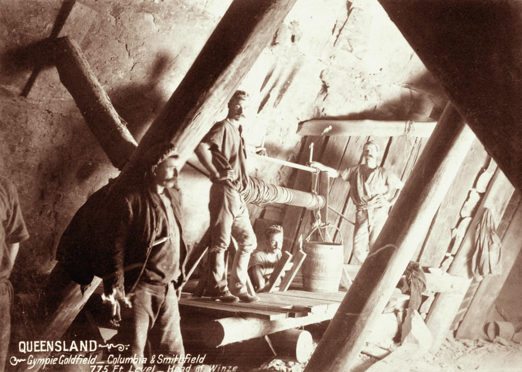 Four miners at head of winze, Columbia and Smithfield at Gympie Goldfield, 775 feet level, 1897