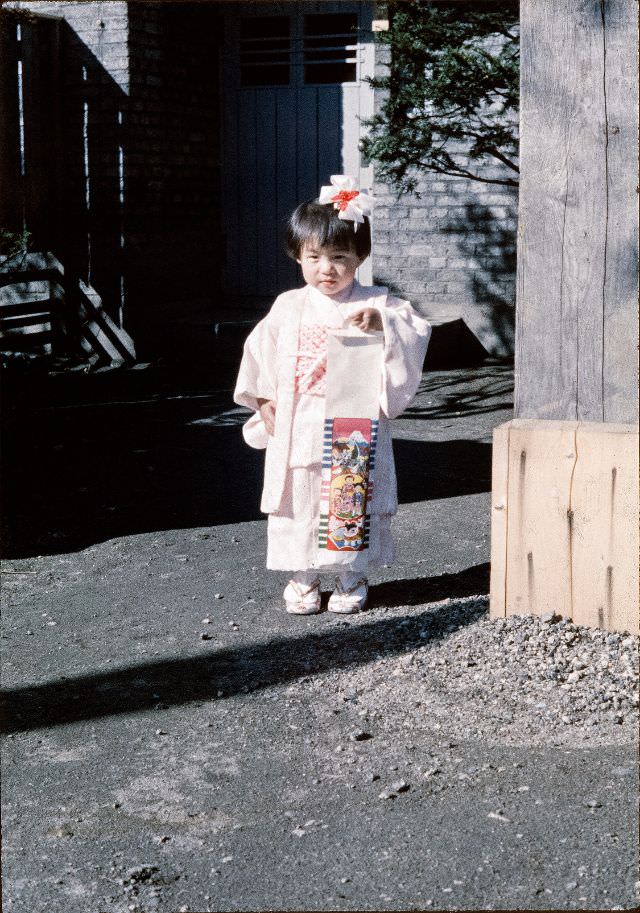 Young girl in kimono with a hair bow