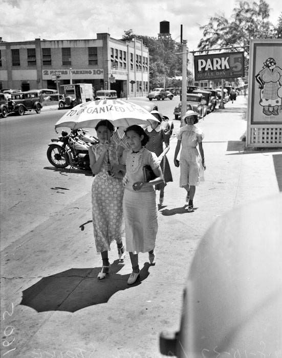 San Antonio Laundry strike - View of women pickets carrying umbrellas, 1937