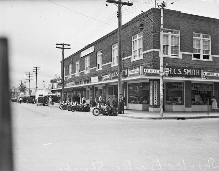 Exterior of building, southwest corner of S. Pecos and E. Commerce Streets, after police removed pickets during strike at Shirlee Frocks, Inc., (109 S. Pecos Street), San Antonio, 1937