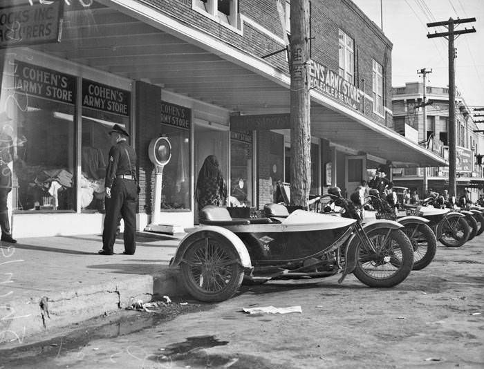 Police patrol sidewalk after removing pickets during strike at Shirlee Frocks, Inc., 109 S. Pecos Street, San Antonio, 1937