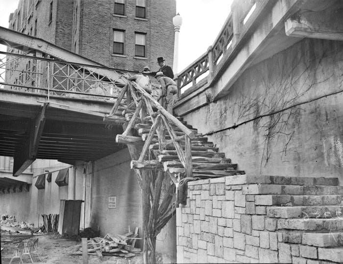 Completing work on cedar and stone stairway during San Antonio River beautification project, 1939