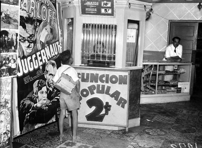Barefoot boy at ticket window of Teatro Progreso, 1938