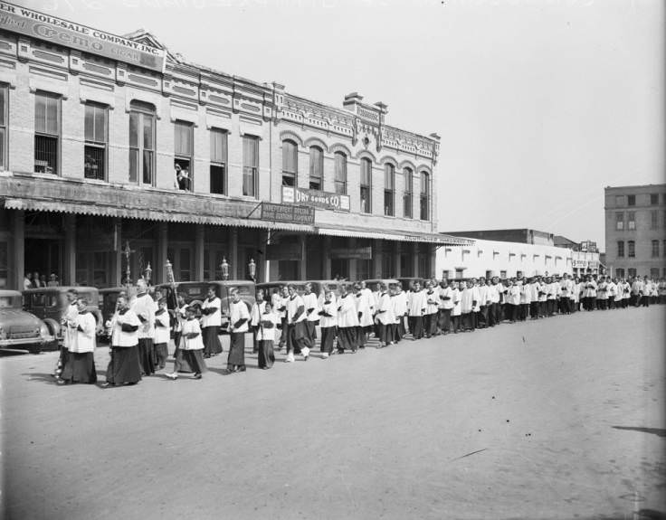 Procession crossing the west side of Military Plaza on way to the consecration of Most Rev. Joseph M. Preciado, rector of San Fernando, to be titular bishop of Tegea, Panama, 1934