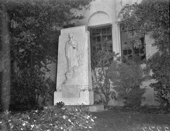 War Mothers Memorial outside windows in Municipal Auditorium that were broken during riot protesting Communist rally, San Antonio, 1939