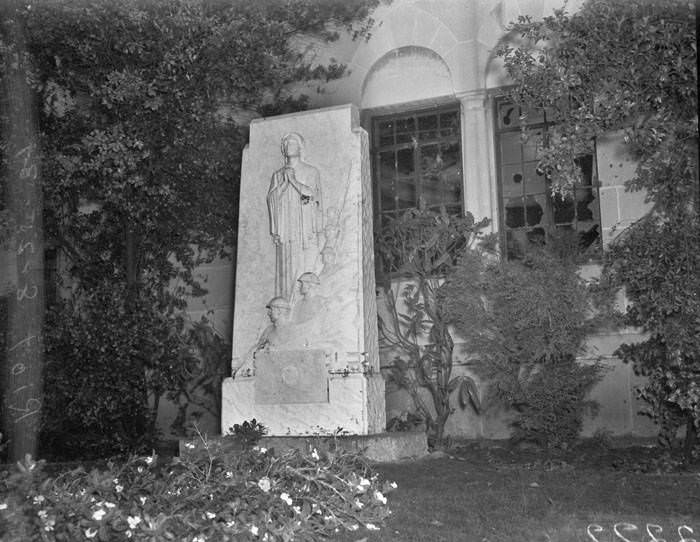 War Mothers Memorial outside windows in Municipal Auditorium that were broken during riot protesting Communist rally, San Antonio, 1939