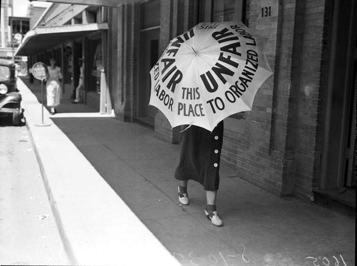 San Antonio Laundry strike - View of women pickets carrying umbrellas, 1937