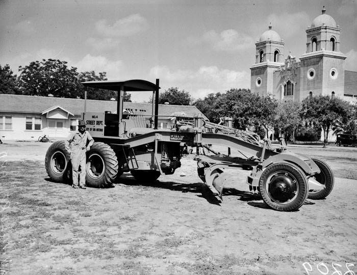 W.W. Lorrilard standing beside new road grader, 1939