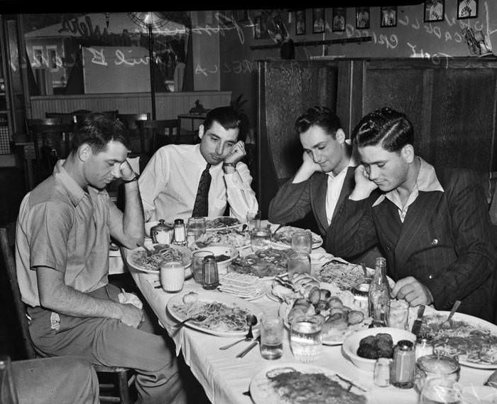 Italian American members of San Antonio Missions eating spaghetti, 1939