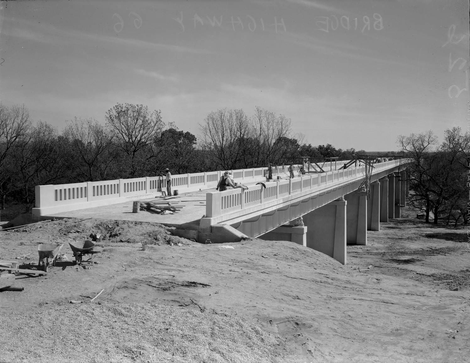 Building a steel and concrete bridge across the Medina River, ten miles south of San Antonio, 1935