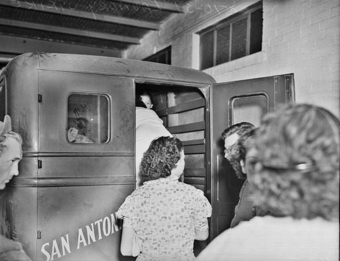 San Antonio Laundry Strike - women getting into company truck, 1937