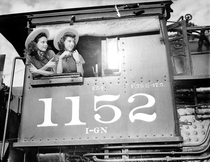 Jerry Smith and Imogene Hawley, Lasso Girls, in cab of train engine, 1939