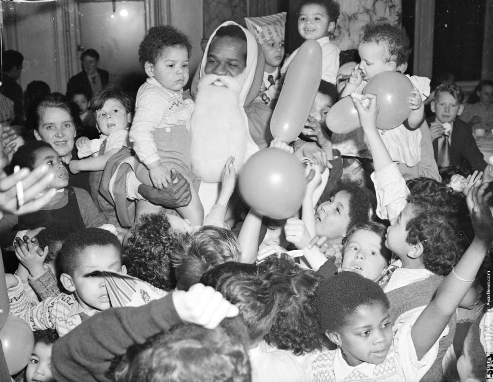 W. MacDonald Bailey as Father Christmas at a childrens party, 1925