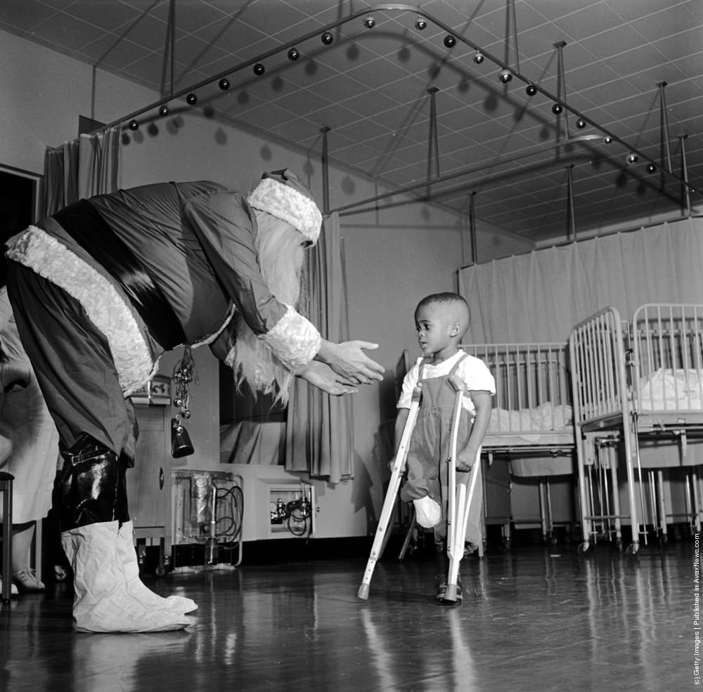 Father Christmas visiting a ward in New Yorks Orthopaedic Hospital, 1950