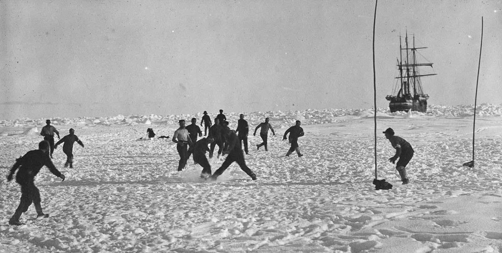 Crew plays soccer on the ice near Endurance.
