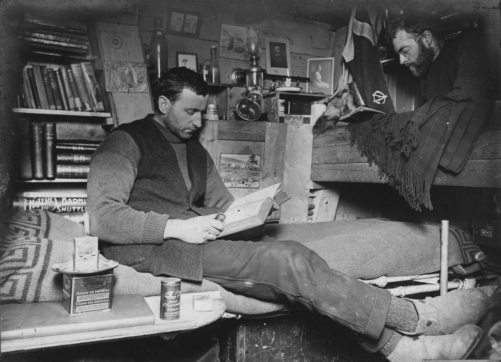 Biologist Robert Clark and geologist James Wordie in their cabin.