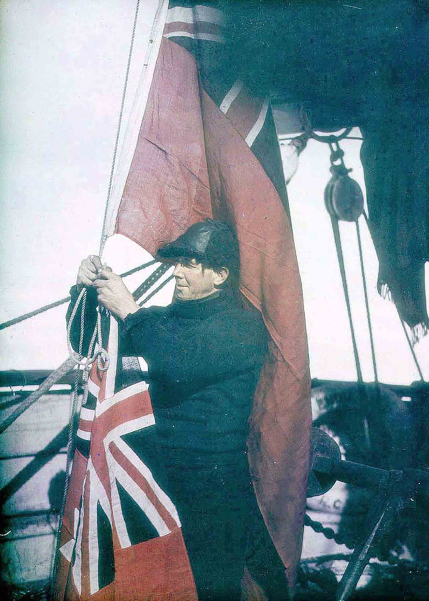 Third Officer Alfred Cheetham adjusts the signal flags of the Endurance.