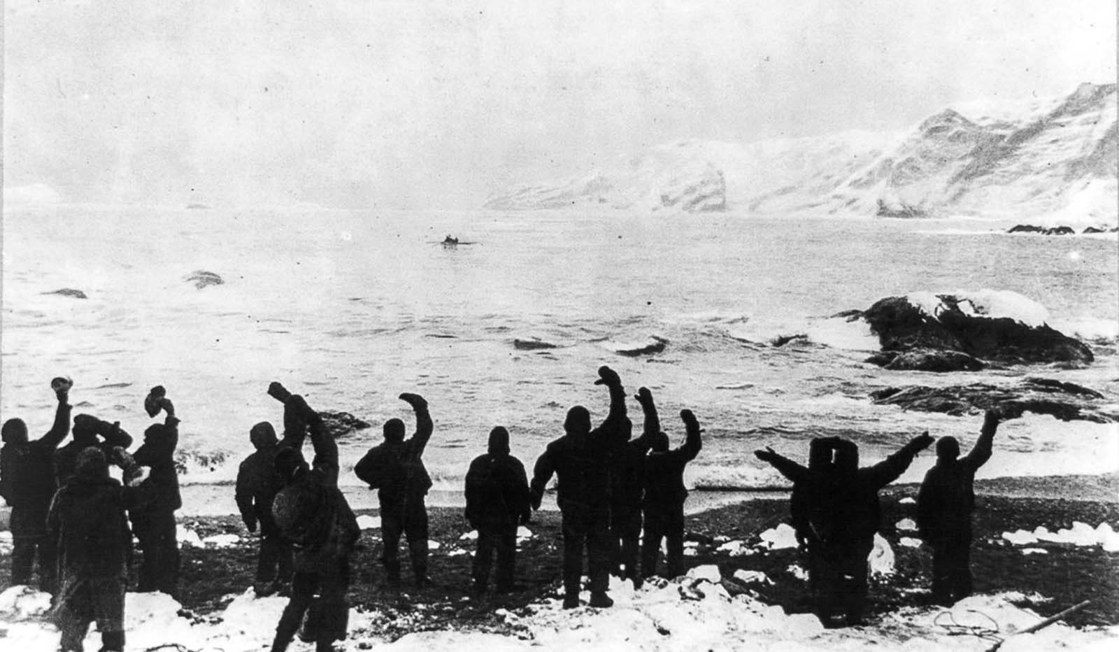 Crew wave farewell as the James Caird sets off for South Georgia Island in search of rescue.