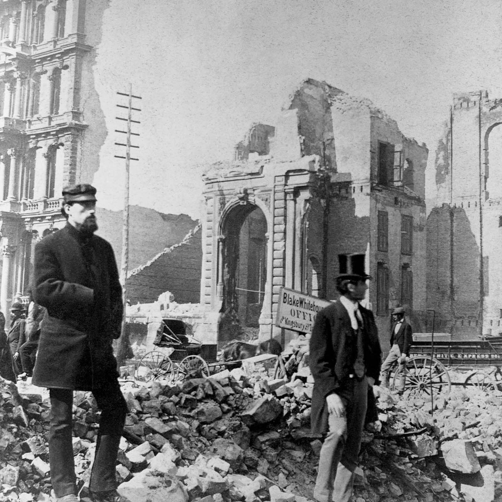 Men stand amid the rubble at LaSalle Street and Washington Street.