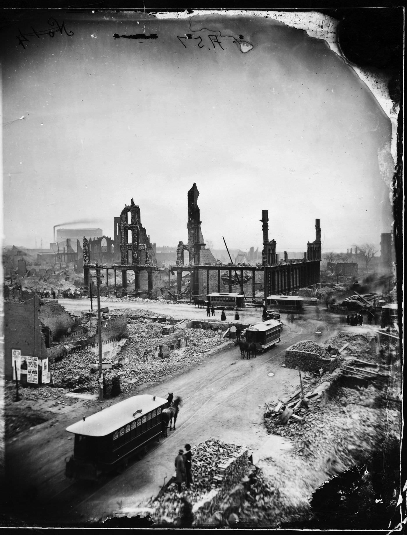 Gutted buildings and smoldering rubble at State and Madison streets after the Great Chicago Fire in 1871.