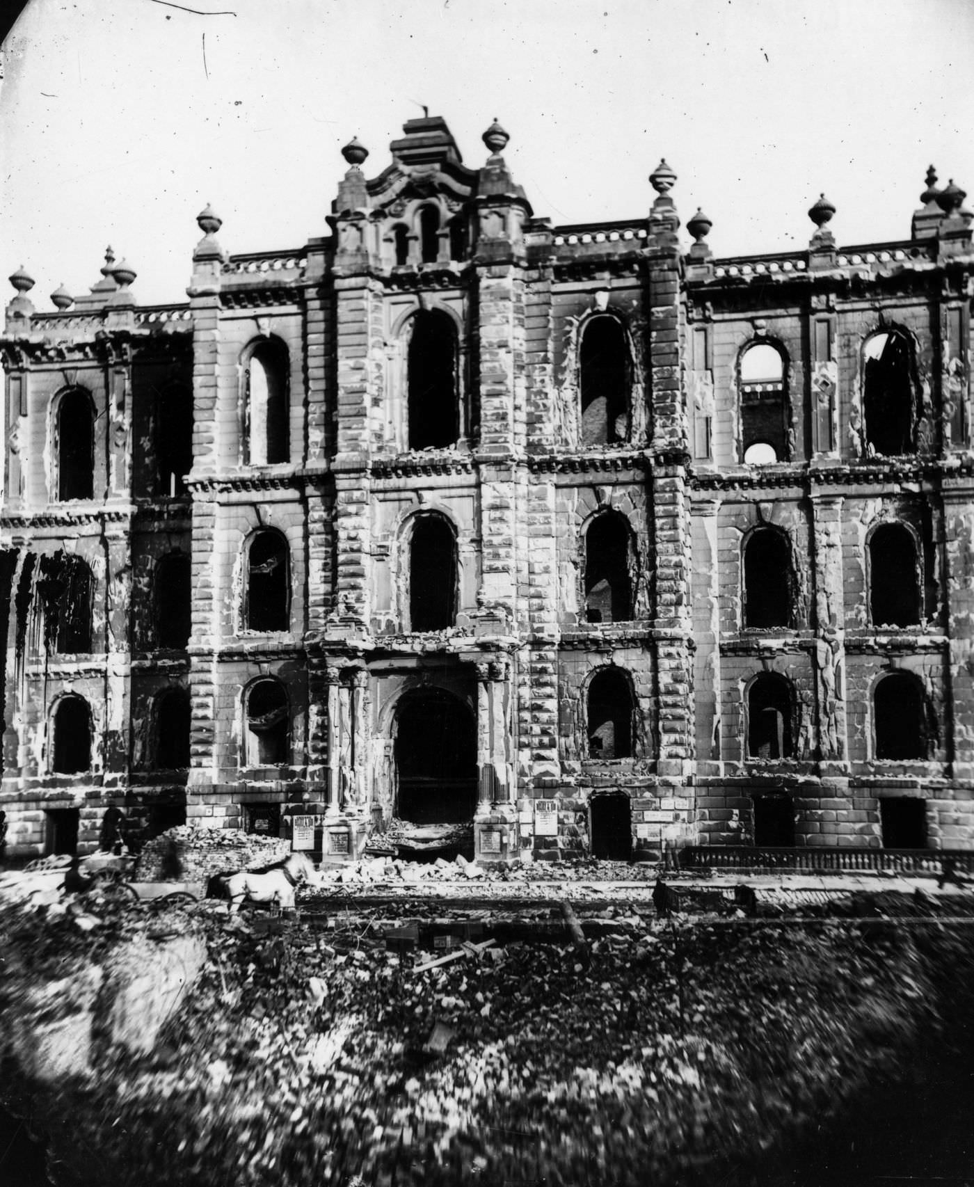 The west entrance to the courthouse shows it in ruins from the Great Chicago Fire in 1871.