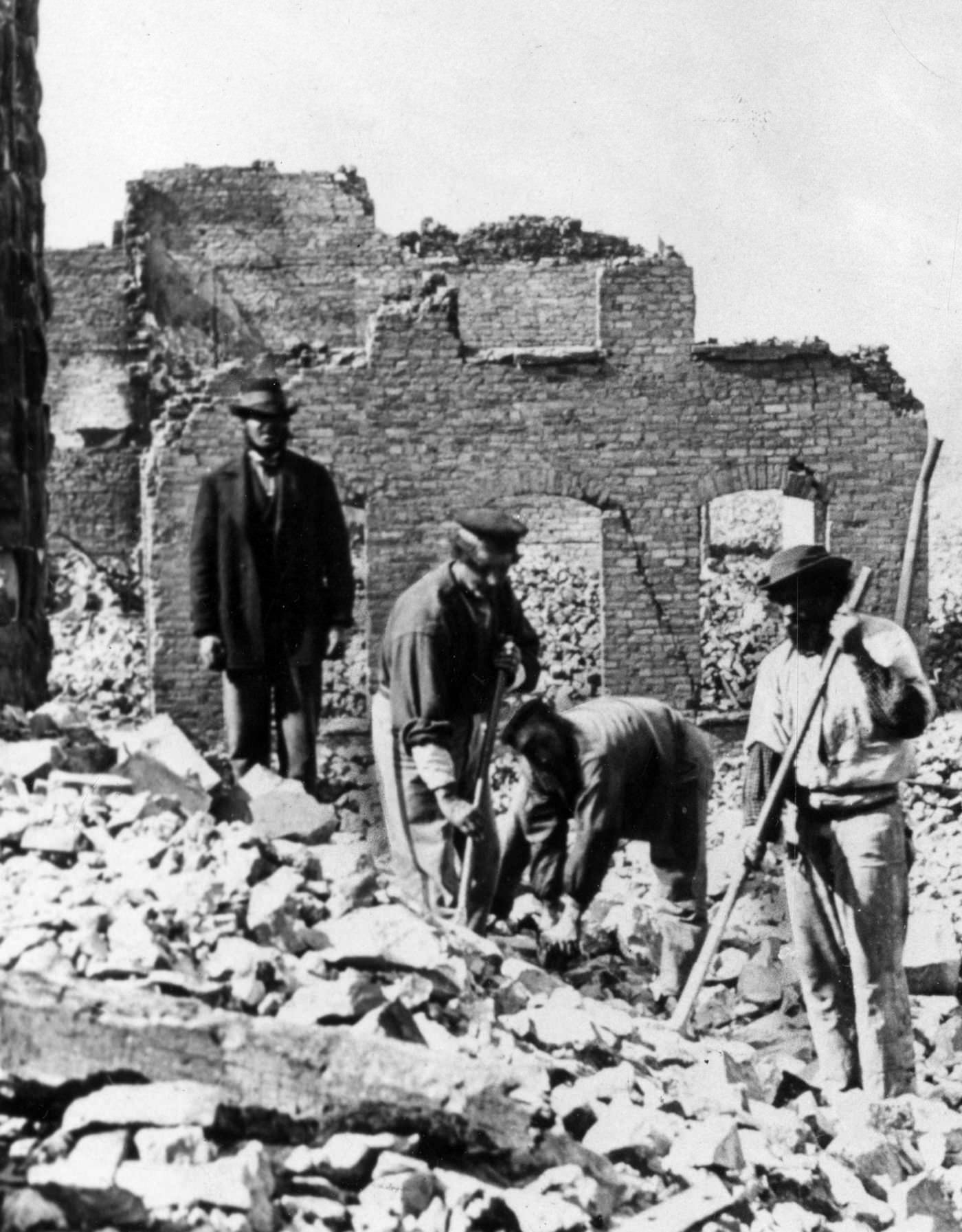 Workers clean up rubble from the Great Central Station, located at the foot of Lake Street after the Great Chicago Fire in 1871.