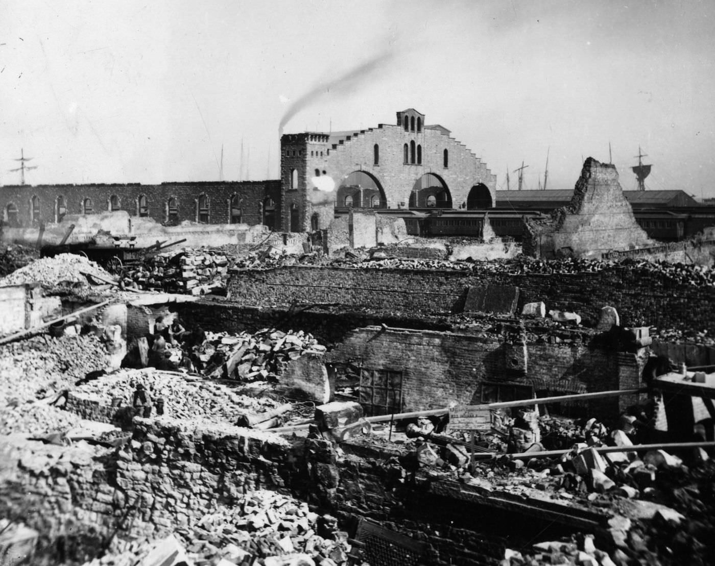 Flames razed the stores and hotels along North Wabash and Michigan avenues and left the shell of the Illinois Central station in the background after the Great Chicago Fire in 1871.