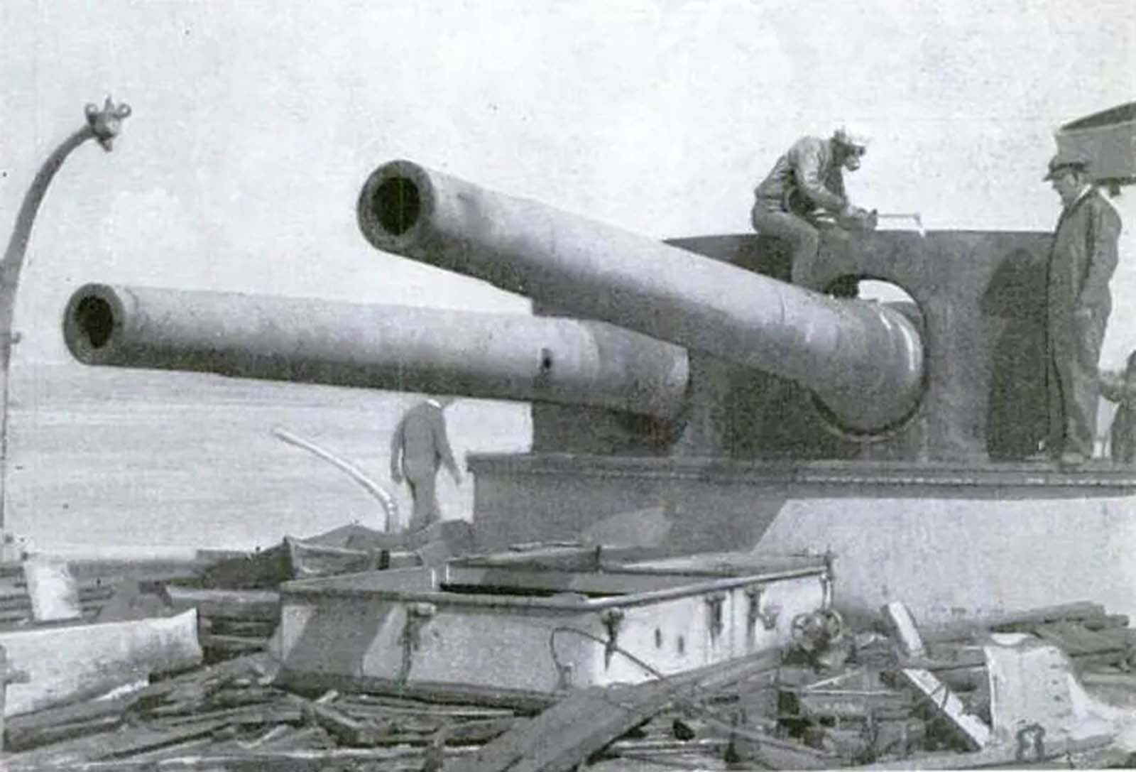 Workers cutting up a main turret of Brooklyn during the scrapping process c. 1922.