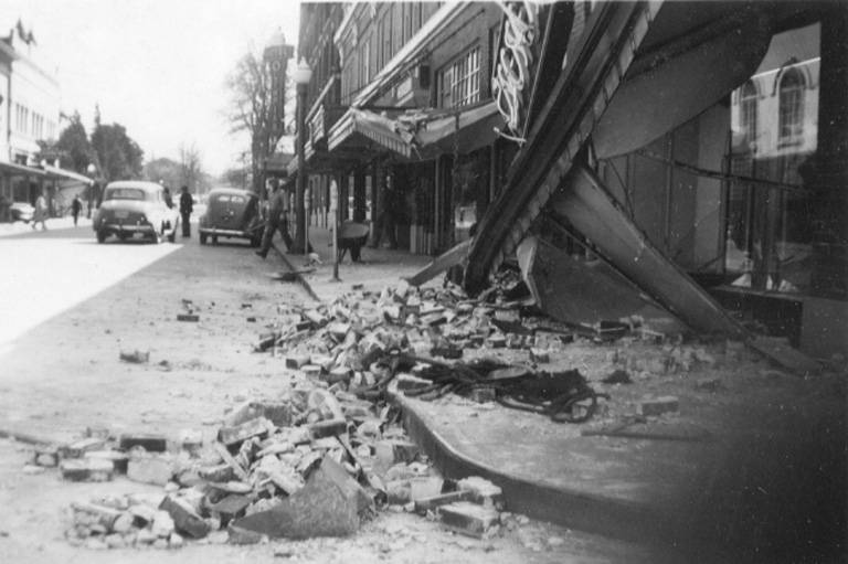 Downtown street view showing fallen canopy and rubble in street after an earthquake, Olympia, April 1949