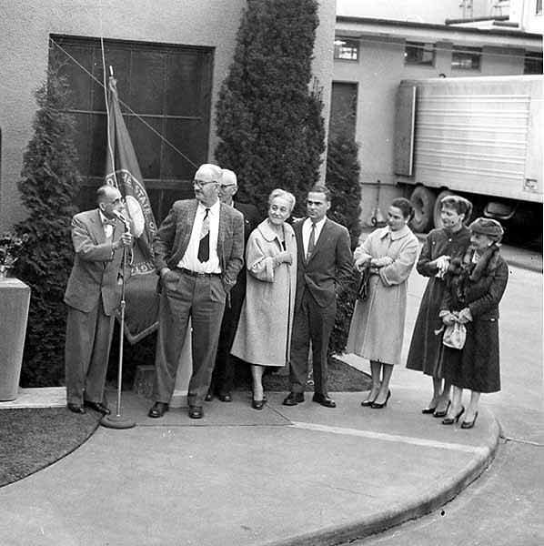 Dedication ceremony for Peter G. Schmidt memorial plaque with sculptor John W. Elliott at microphone, Olympia Brewing Company, 1958