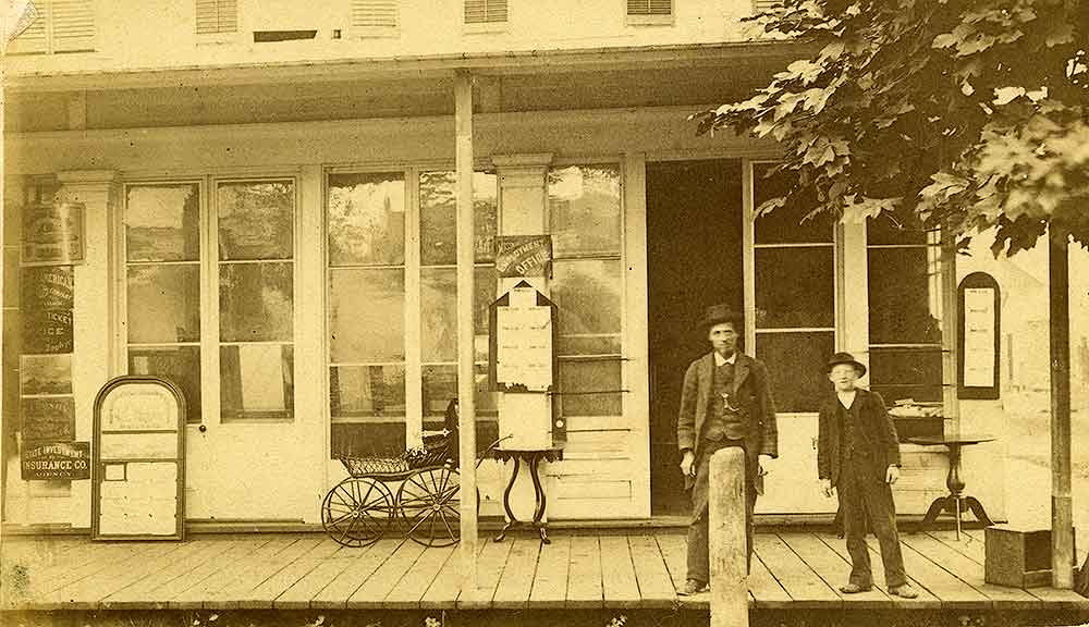 A storefront identified as the Isaac V. [Van Dorsey] Mossman store, Olympia, 1870