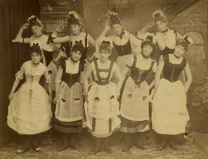 A group of nine girls performing in an operetta in Olympia, 1888