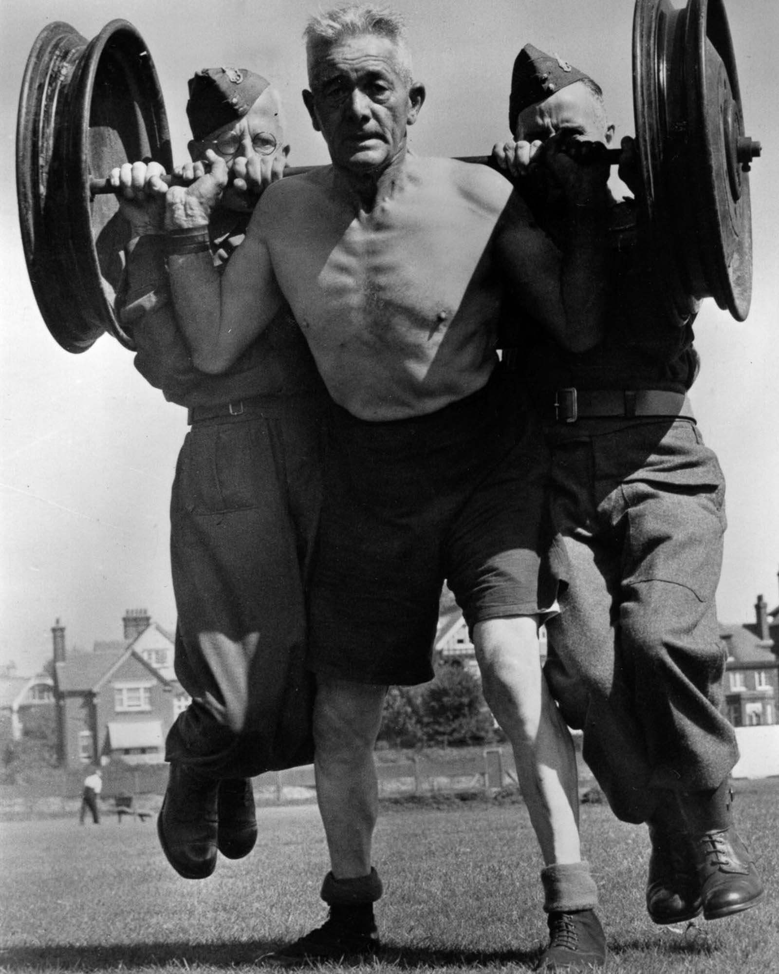 A 60-year-old British soldier lifts 500 pounds of man and steel, 1941.