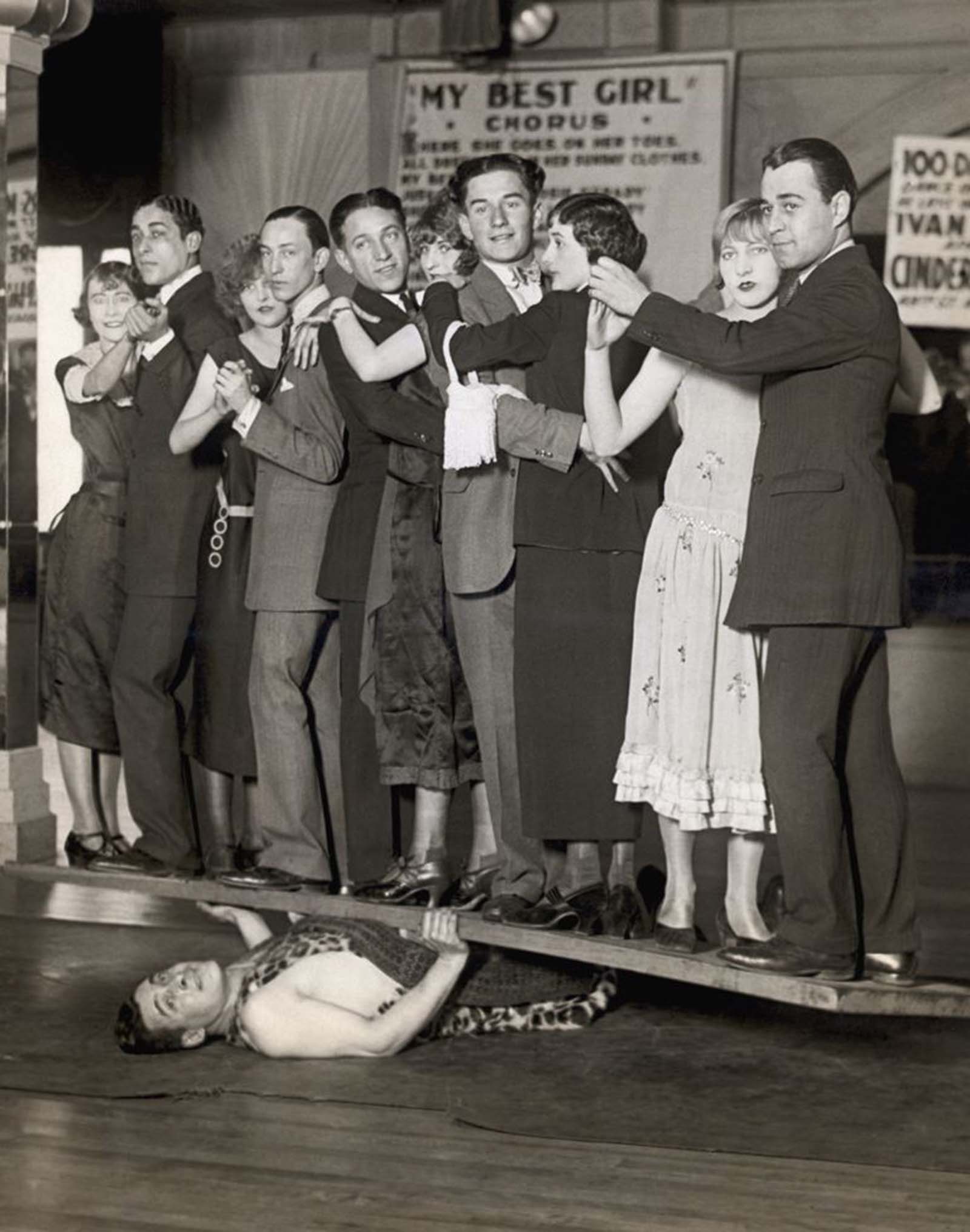 The world’s strongest strongman, Ivan “The Great” demonstrates his strength by holding a plank with five dancing couples on it, 1924