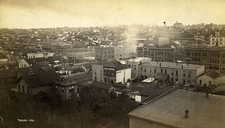 Mostly commercial buildings are in the foreground and center of the image, Tacoma, 1888