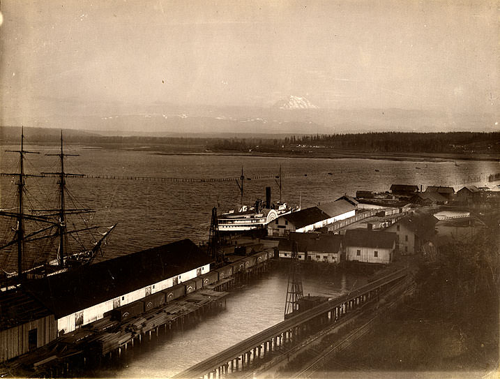 Tacoma waterfront, sidewheeler steamship, tideflats, Mt. Rainier, 1889