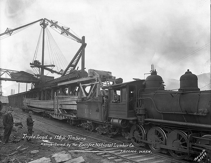 Triple load of 128 ft. timbers, manufactured by the Pacific National Lumber Co., Tacoma, 1924