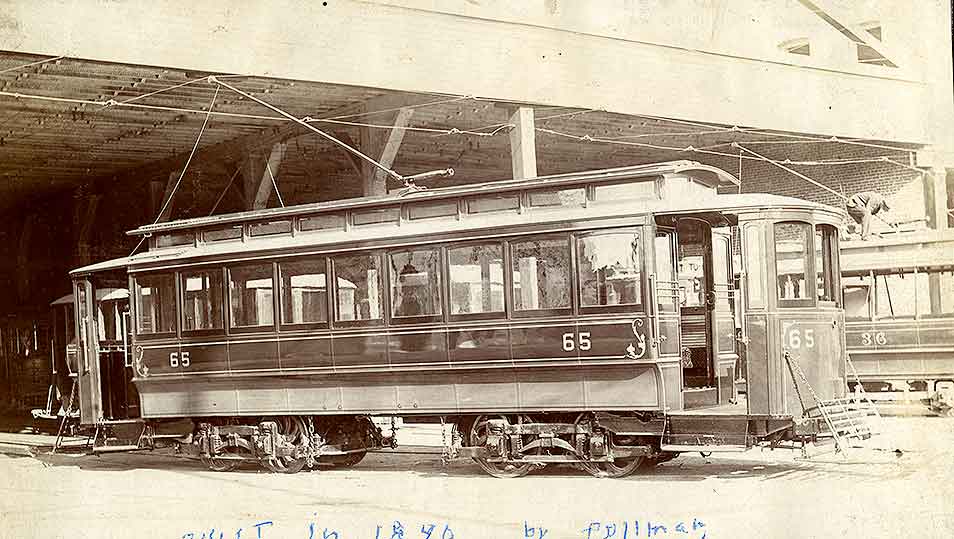 A view of the right side of Tacoma Railway and Power Company's streetcar No. 65 in the car house, 1903