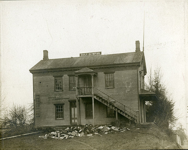 A two-story clapboard building identified as the Daily Olympian Building, Olympia, 1900s.