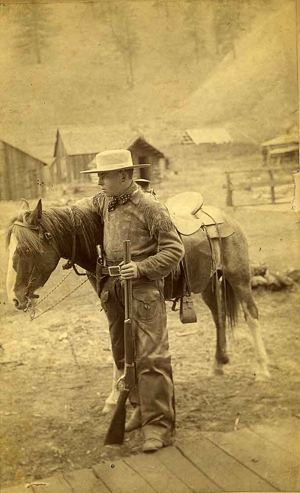 Ray Laughton as cowboy, Olympia, 1900s