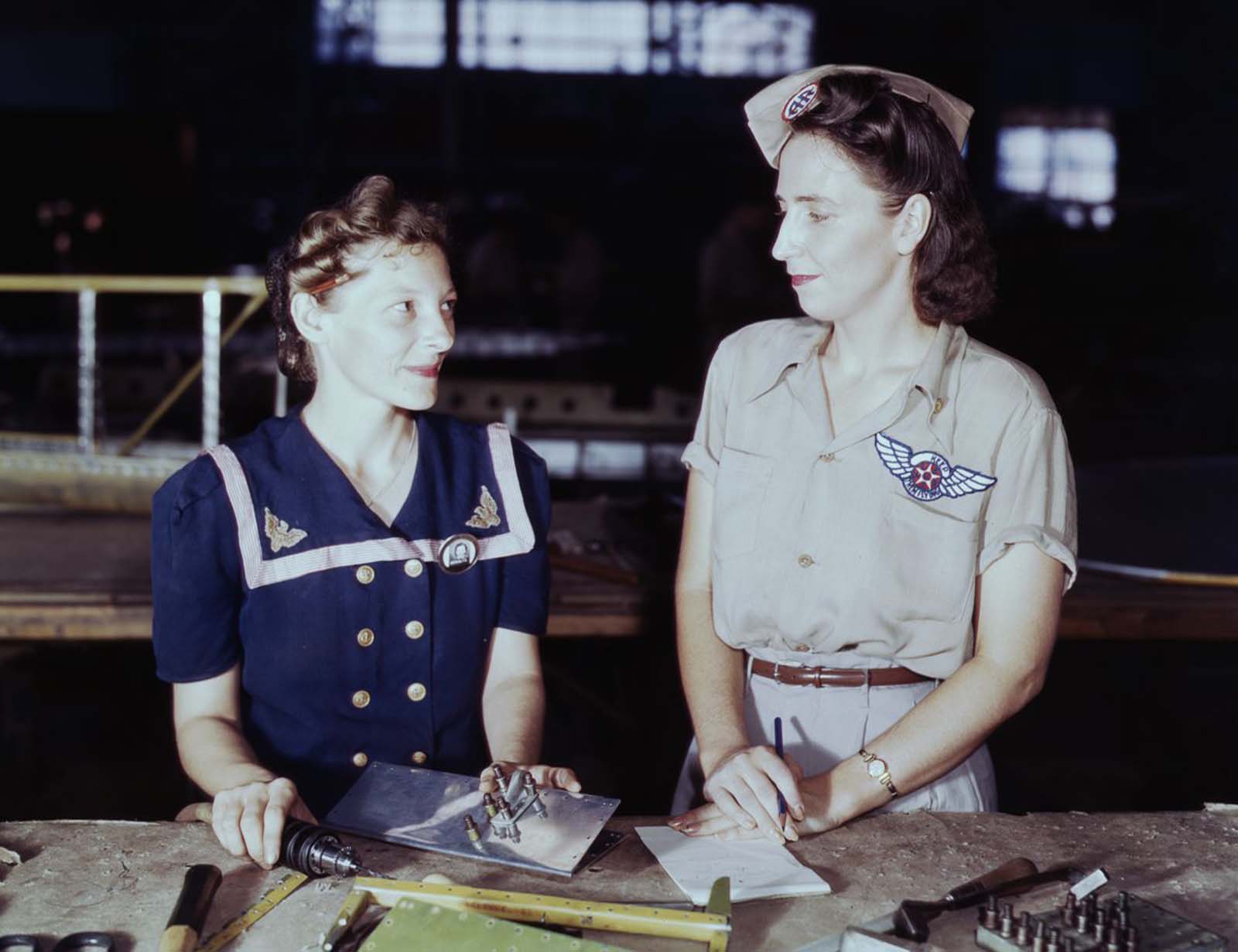 Virginia Young, right, a Pearl Harbor widow, is a supervisor in the Assembly and Repairs Department of the Naval Air Base.