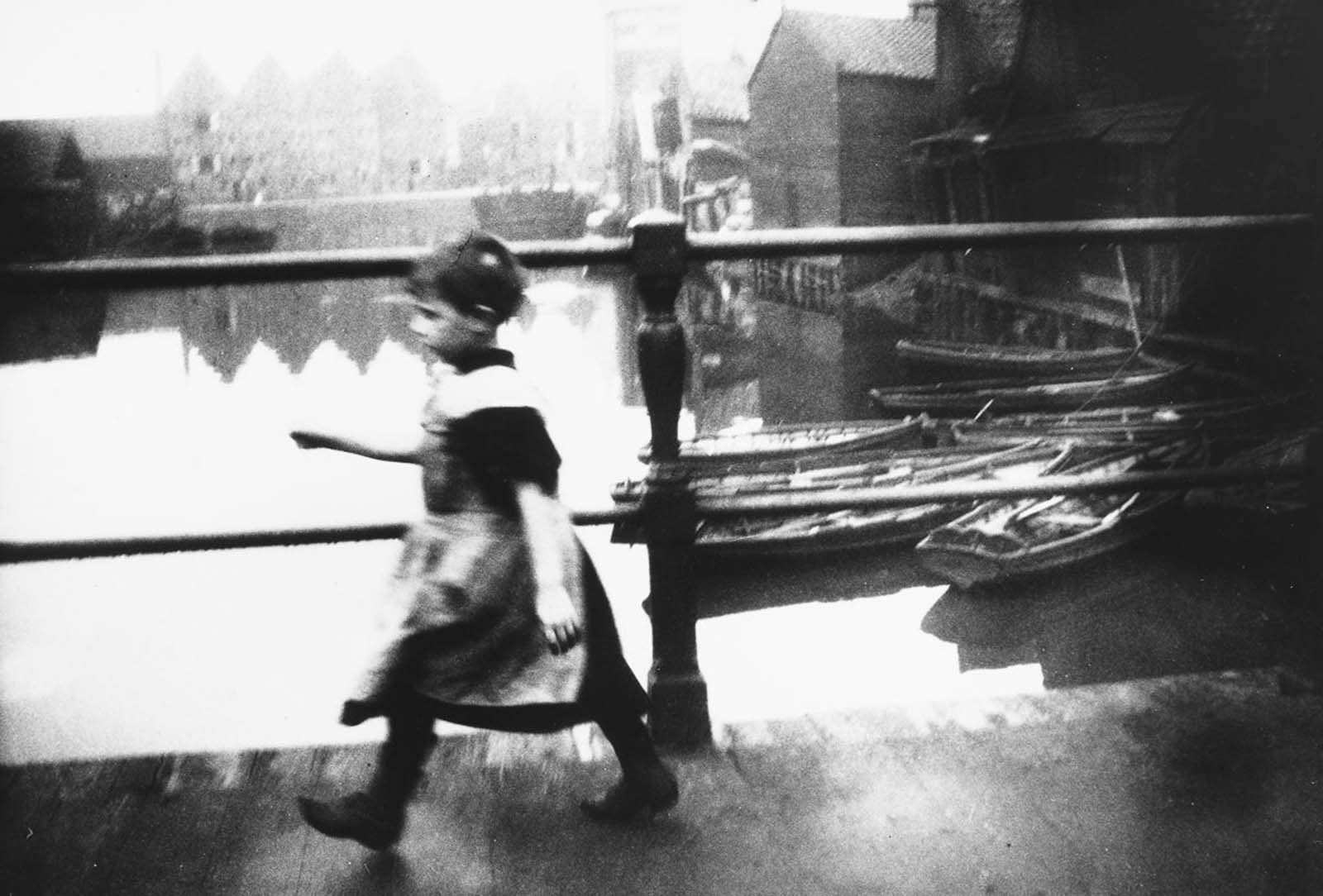 A girl crosses a bridge on Prince Island.