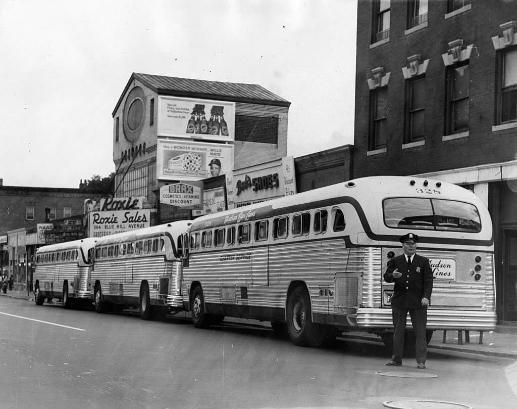 Buses are lined up in front of 366 Blue Hill Ave. in Boston to take children to schools outside their districts in Boston on Sept. 13, 1965.