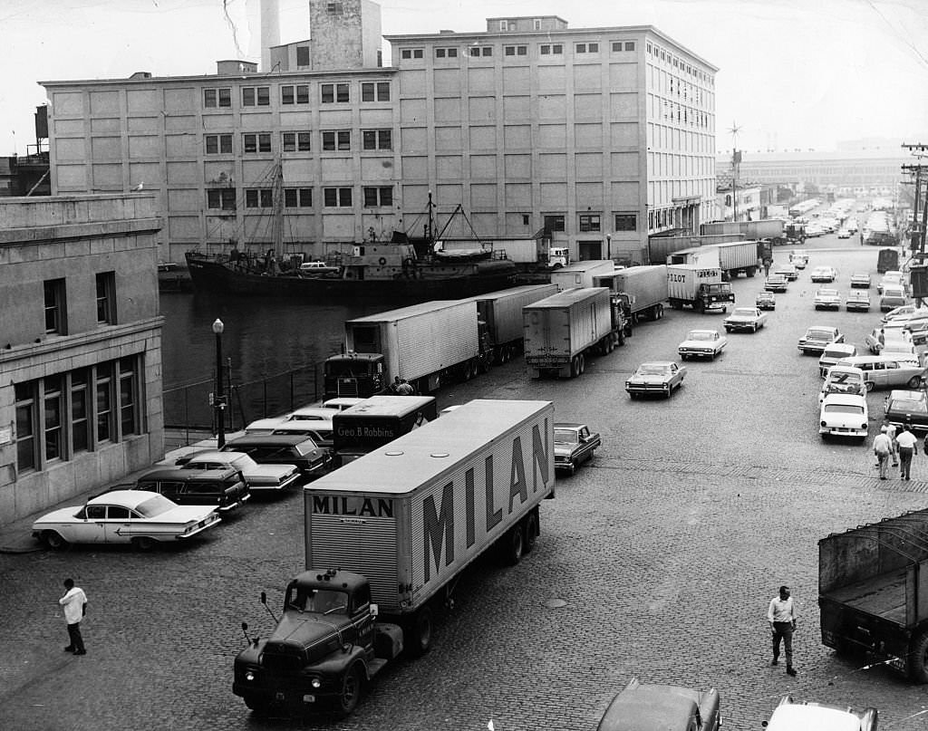 Cars and trucks drive on Northern Avenue in Boston, 1965.