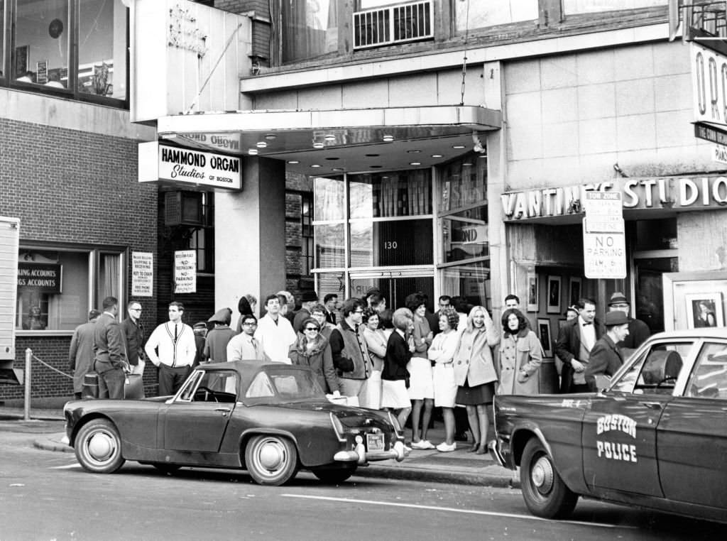 The scene at 130 Boylston St. in Boston following a holdup at the Hammond Organ store, 1965.
