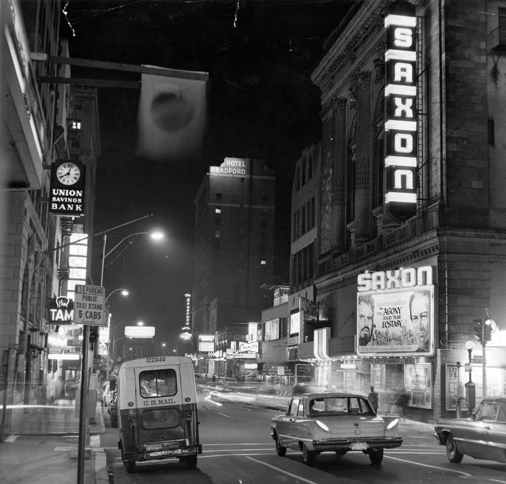 Washington Street in Boston at night, Nov. 10, 1965. Saxon Theatre is on right, Union Savings Bank on left. (Photo by Phil Preston/The Boston Globe via Getty Images)