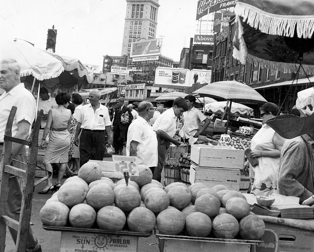 The Custom House tower stands behind a busy Faneuil Hall marketplace in Boston on July 16, 1966.