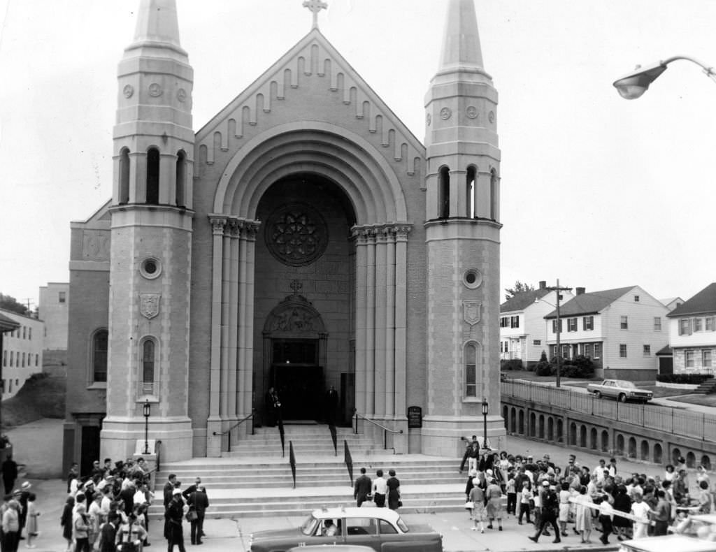 A crowd gathers outside St. Brendan's Church in the Dorchester neighborhood of Boston.